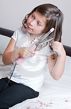 Young Schoolgirl Curling her Hair