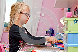 Young schoolgirl doing homework