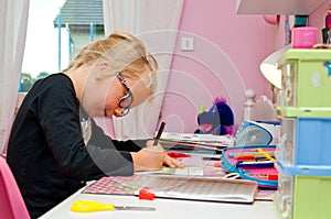 Young schoolgirl doing homework