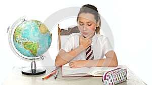 Young schoolgirl in geography class