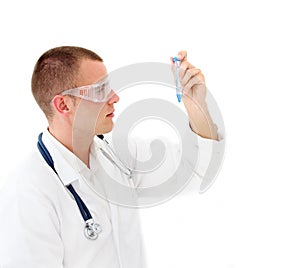 Young scientist checking a test tube