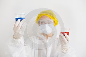 Young scientist holding containers