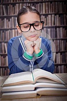 Young scientist, hustler with glasses in the library, learn from