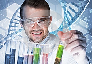 Young scientist mixing reagents in glass flask in clinical laboratory