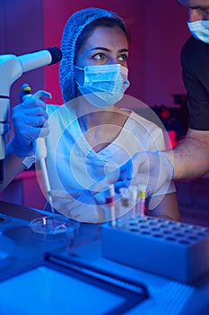 Young scientist in a modern cryo-laboratory works with biomaterial