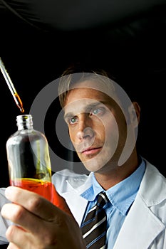 Young Scientist Performing Experiment