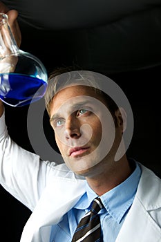 Young Scientist Performing Experiment