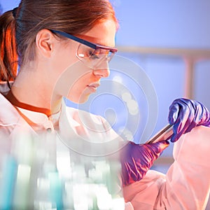 Young scientist with a smarth phone.