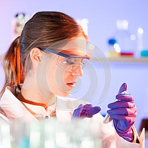 Young scientist with a smarth phone.