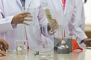 Young scientists are doing experiments in science labs.