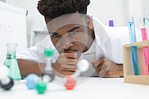 Young scientists studying dna models