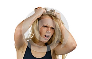 Young screaming woman tearing her hair