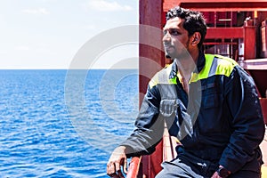 Young seafarer on the cargo ship.