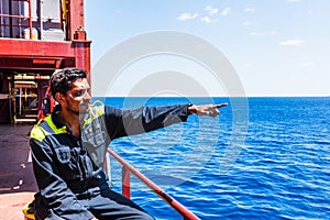 Young seafarer on the cargo ship.