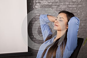 A young secretary enjoys a free moment, rest at work,portrait