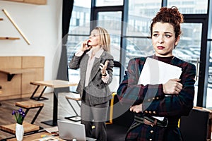 Young secretary leaving strict female boss almost crying