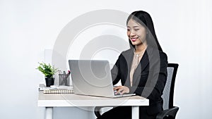 Young secretary woman checking her boss`s meeting to typing email to her boss and clients