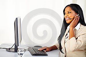 Young secretary working on a callcenter photo