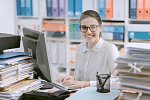 Young secretary working and smiling