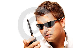 Young security man with radio transmitter