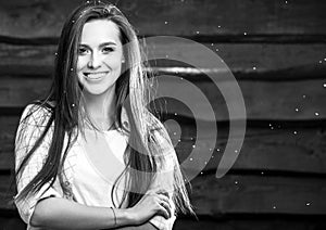 Young sensual & beauty brunette woman pose on wooden background. Black-white photo