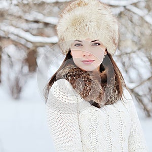 Young sensual girl in winter. Beautiful brunette posing outdoor