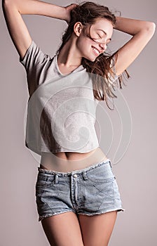 Young sensual model girl pose in studio.