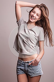 Young sensual model girl pose in studio.