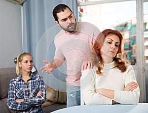 Young serious couple has a family stressful conversation at home