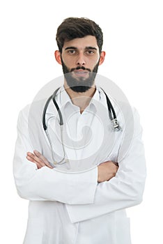 Young serious handsome bearded doctor with white coat and stethoscope.