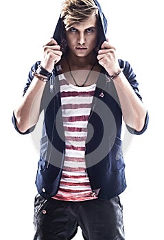 Young serious hooded man teen boy on white background