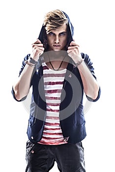 Young serious hooded man teen boy on white background