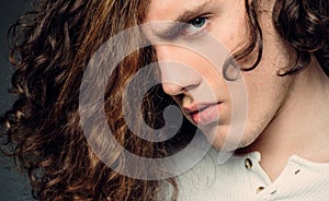 Young serious man. Close up. Man with confident face and brutal style. Stylish young man. Portrait casual serious man.