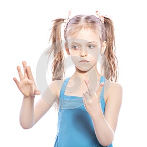 Young seven years old brunette girl in blue dress on a white iso