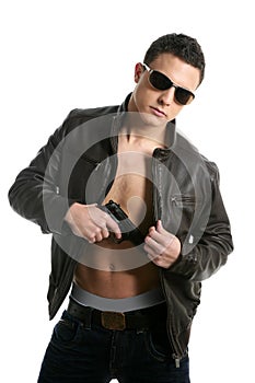 Young boy sunglasses leather and gun