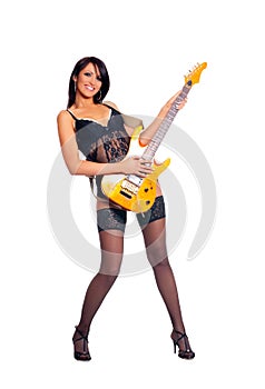 A young and female rockstar with a guitar