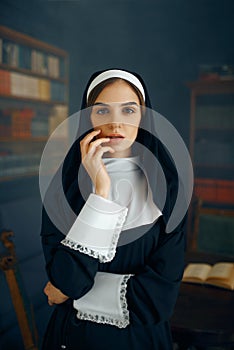 Young sexy nun in a cassock, vicious desires