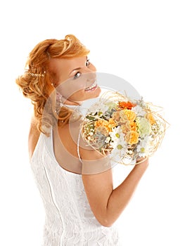 Young and redhead bride with a bouquet