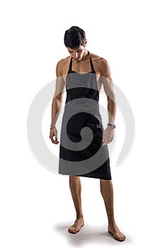 Young shirtless chef or waiter wearing only apron