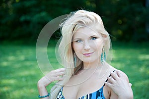 Young spring woman in green park