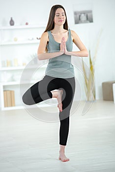 young sexy woman standing yoga pose
