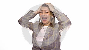 Young shocked surprised woman standing isolated over white background while looking camera