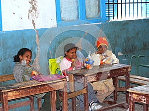 Young shy girls sitting on their disks at school in Egypt