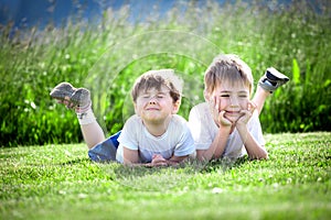 Young siblings on grass