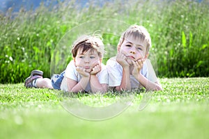 Young siblings on grass