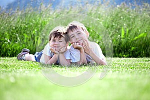 Young siblings on grass