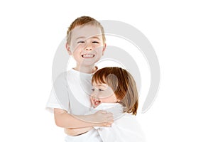 Young siblings hugging