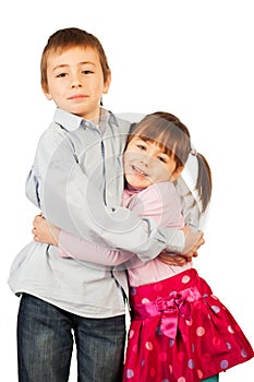 Young siblings hugging