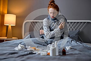 Young sick ginger woman having a heart attack