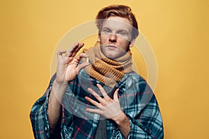 Young Sick Guy Wrapped in Plaid Having Pill